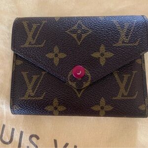 Authentic LV Wallet. Small wear to the snap and spot in zipper coin pouch.